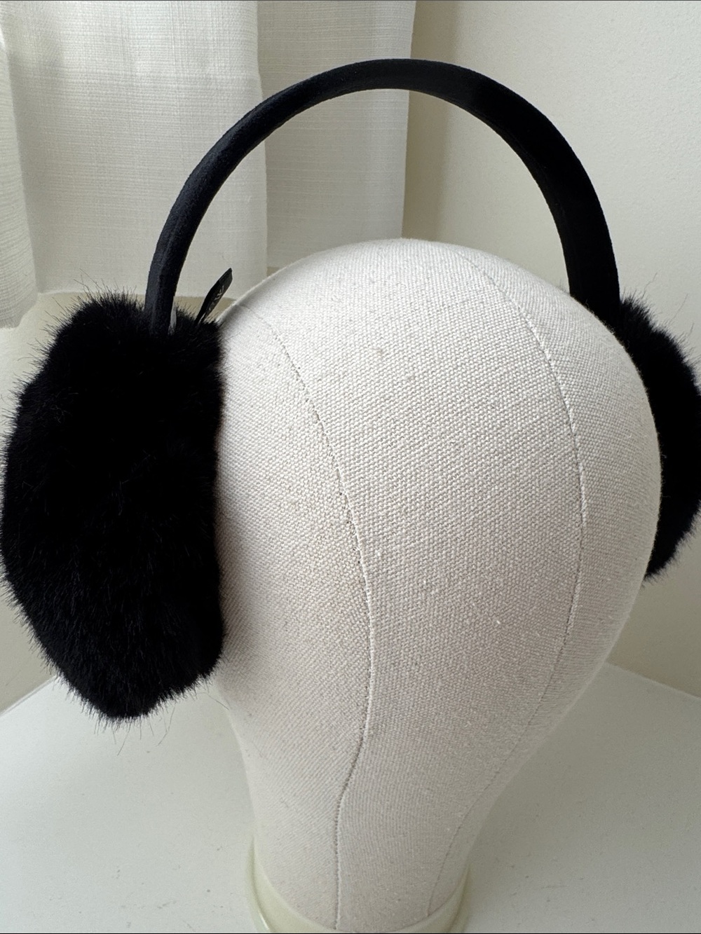 J. Crew black faux fur ear muffs.